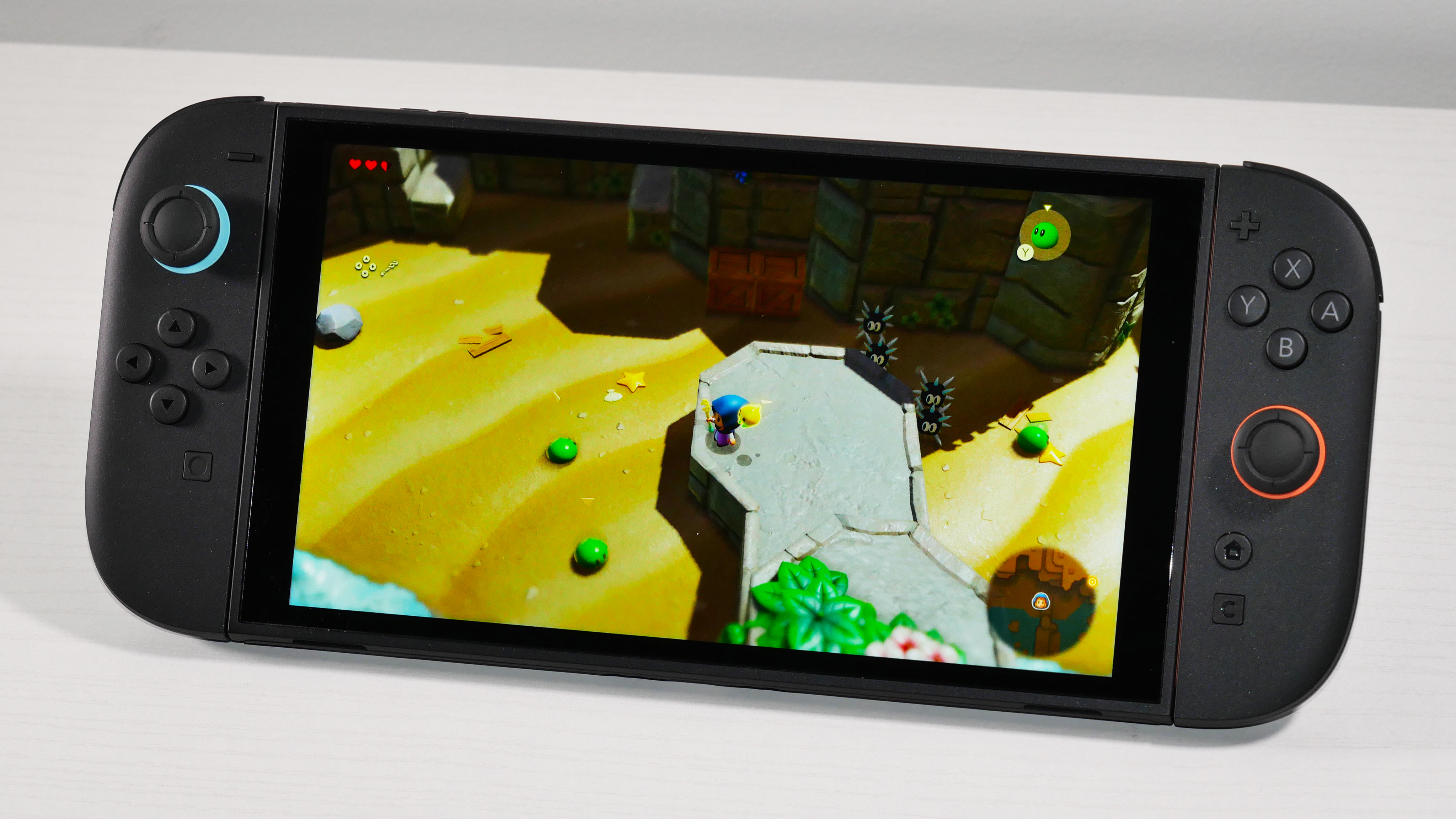 Nintendo Switch 2 Βάζοντας ένα λευκό γραφείο, υπογραμμίζοντας την οθόνη του.